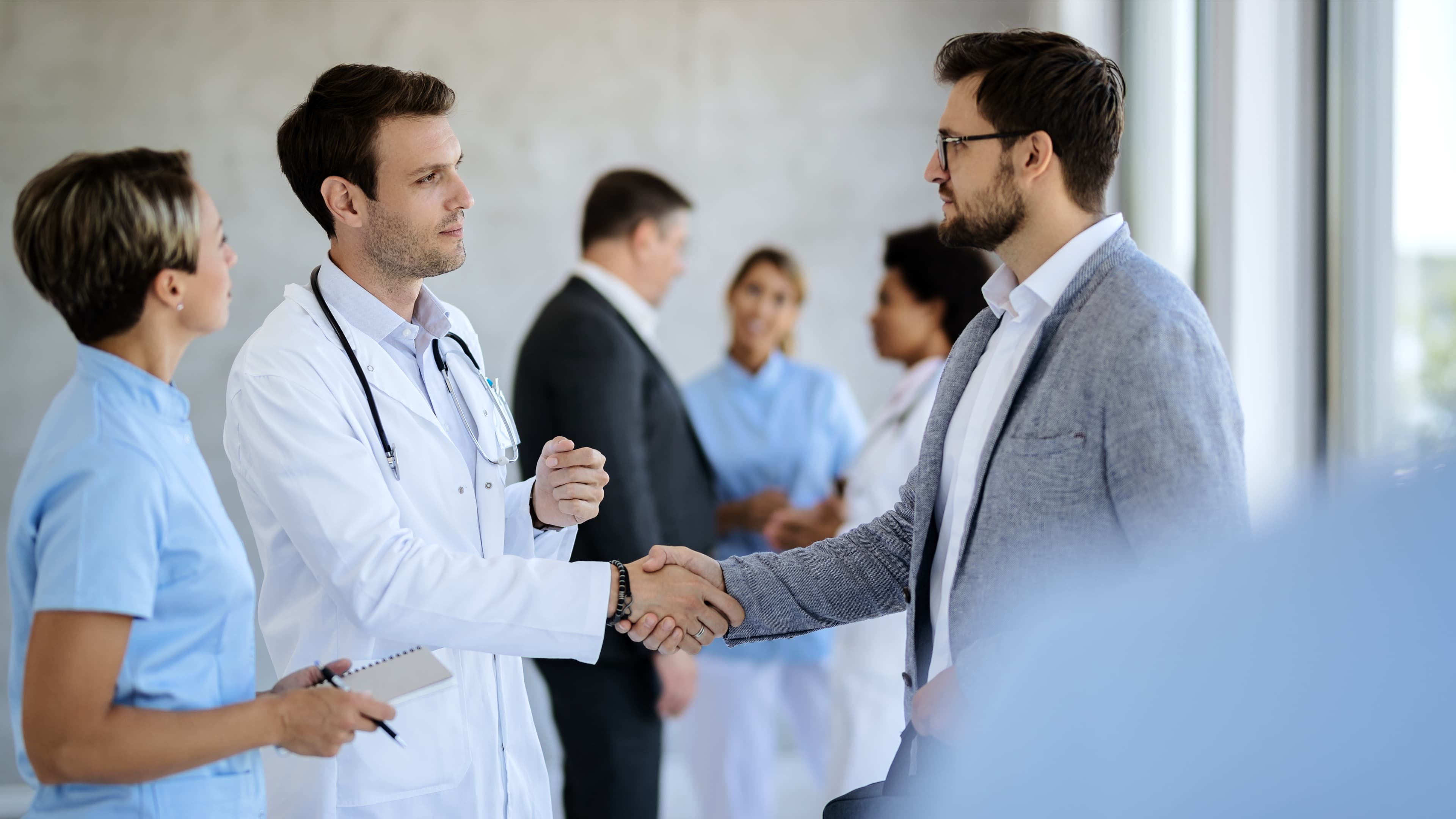 Doctor and patient shaking hands